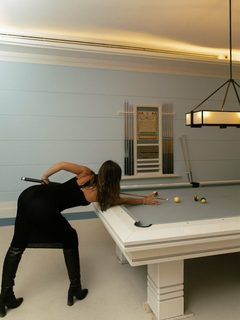 Mika is playing billiards